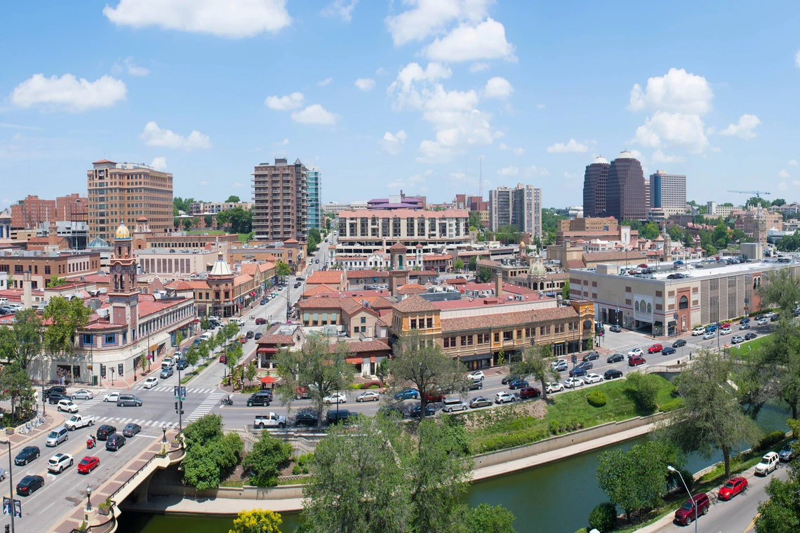 An aerial view of the Country Club Plaza in Kansas City, Missouri, showcasing Spanish architecture along the canal and b
