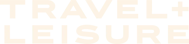Bold white text spelling out "TRAVEL + LEISURE" on a black background, representing a travel publication logo.