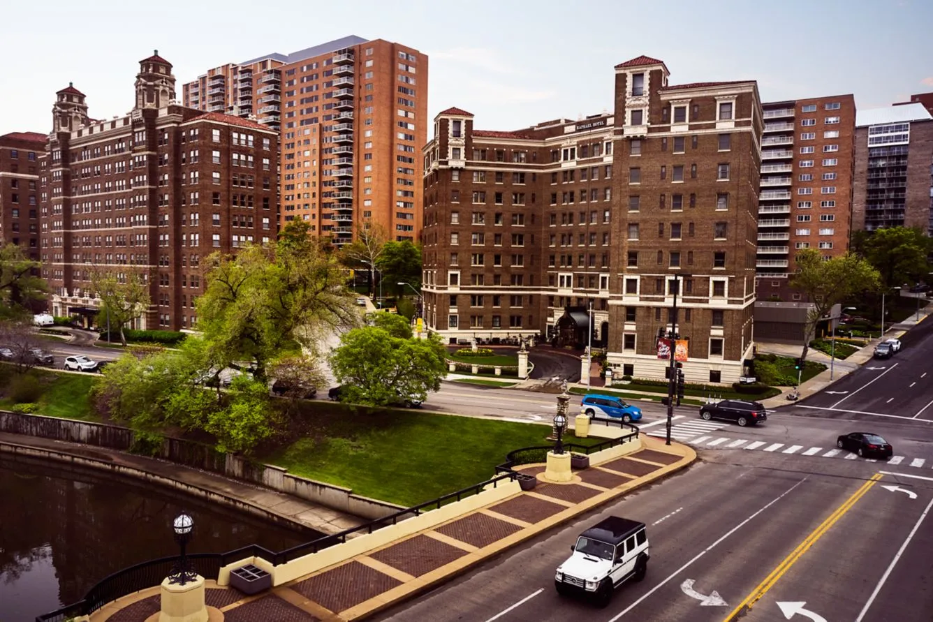 The Raphael Hotel historic brick exterior by the stone bridge and canal, a premier Country Club Plaza hotel in Kansas City.