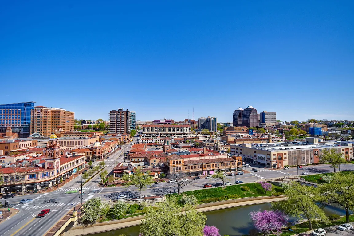 Red-tiled roofs of Country Club Plaza hotels near Brush Creek, a scenic historic district in Kansas City steps from The Raphael Hotel.